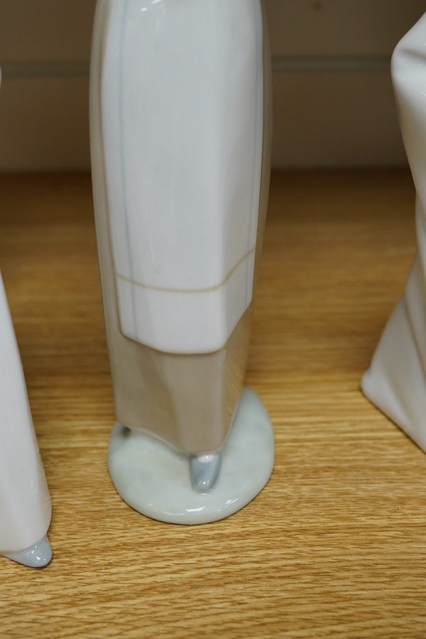 A Royal Doulton Images group and four LLadro figures